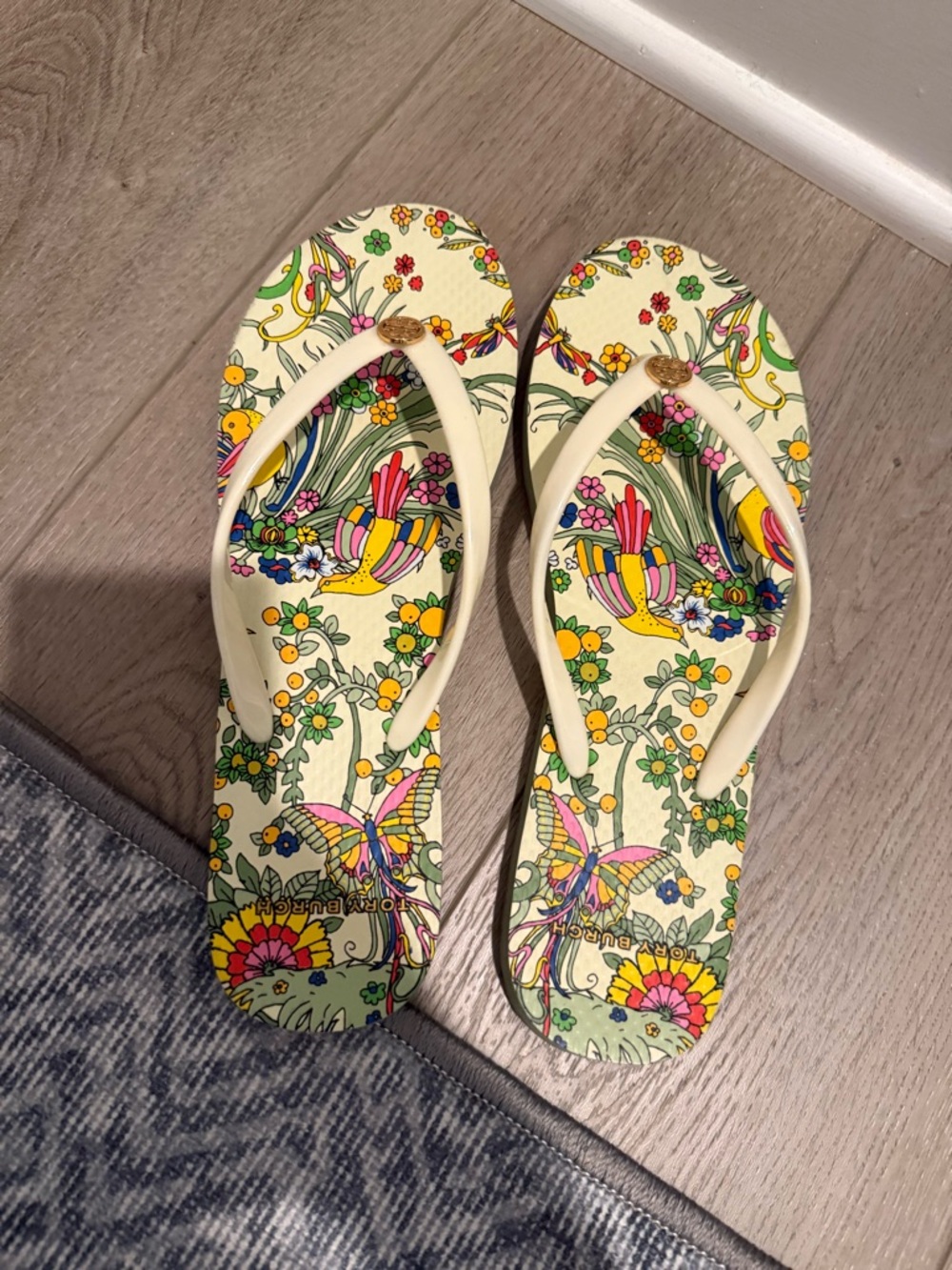 Tory Burch Cream Flip Flops with Multicolor Floral & Butterfly Print